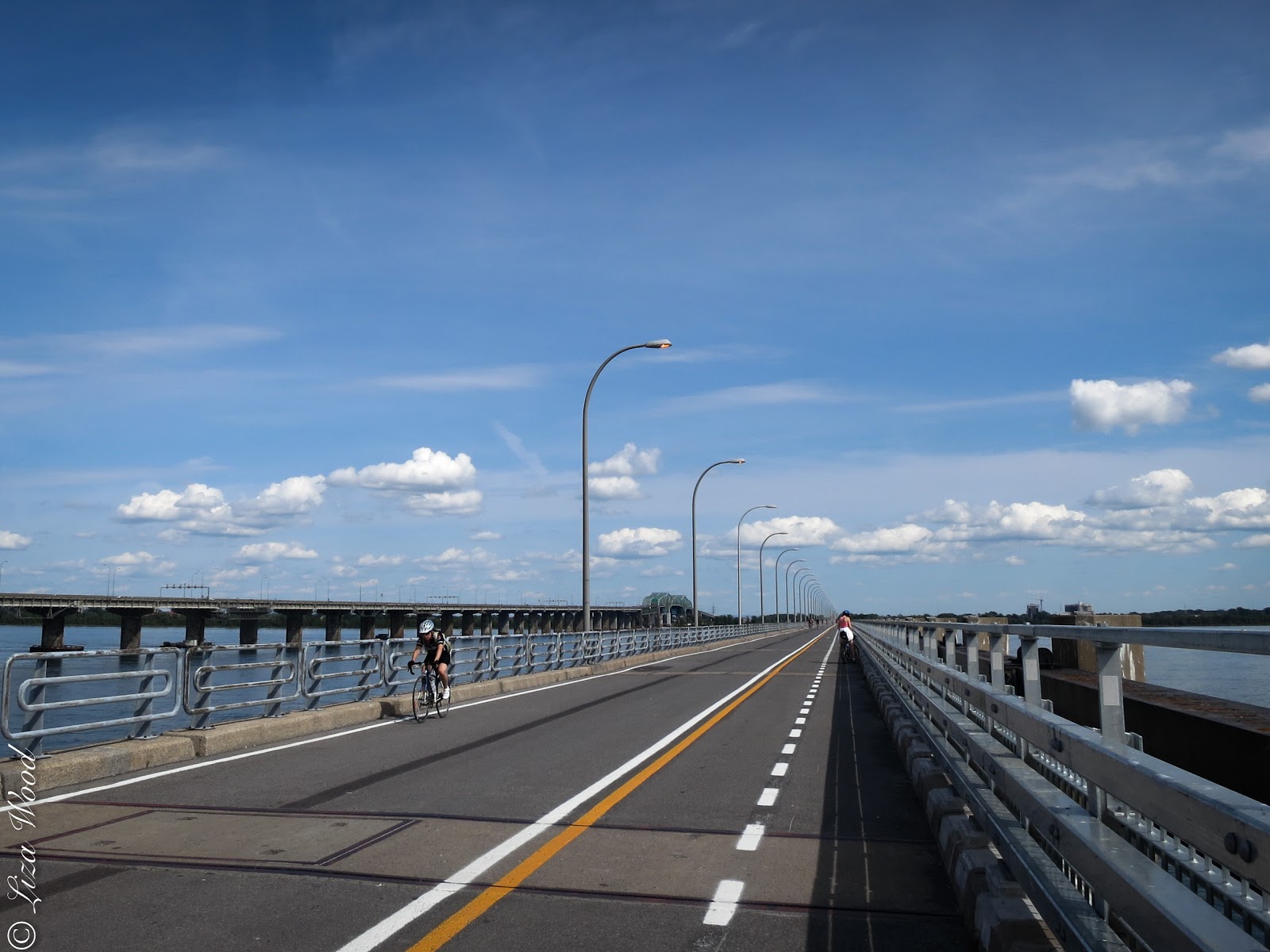 Cycling along bridge over St. Lawrence River