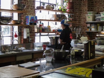 Woman mixing in a brightly lit kitchen