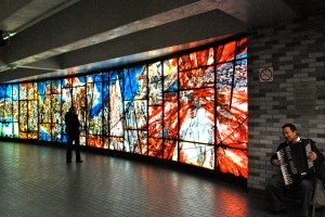 Accordian player and stained glass art at place des arts metro