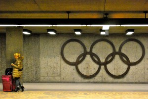 Woman waiting with luggage at Pie-IX metro