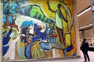 Man admiring mosaic at Sherbrooke metro