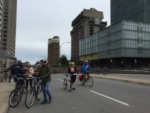 Cyclists walking up hill